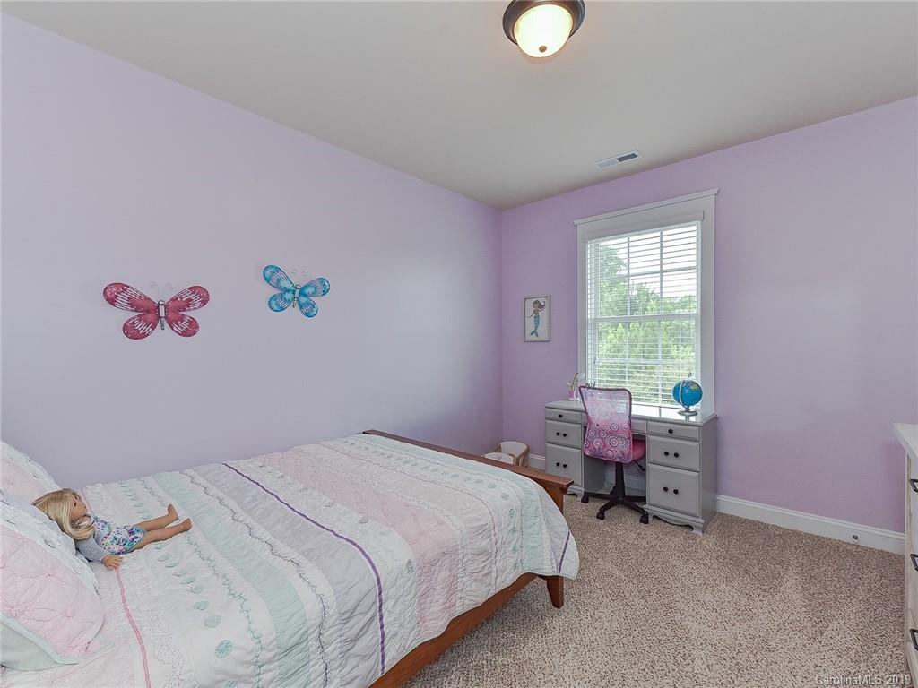 313 Olmstead Street Fort Mill, SC 29708 - Photo 32 of 48 a bedroom with a bed and a window
