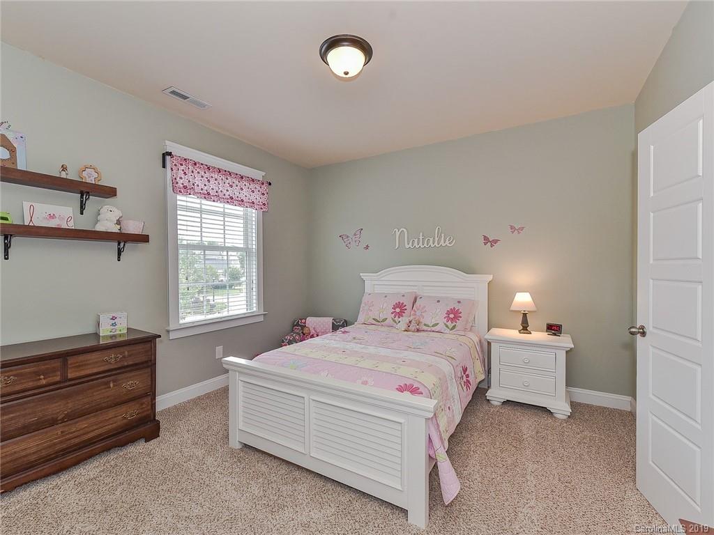 313 Olmstead Street Fort Mill, SC 29708 - Photo 33 of 48 a bedroom with a bed and a window