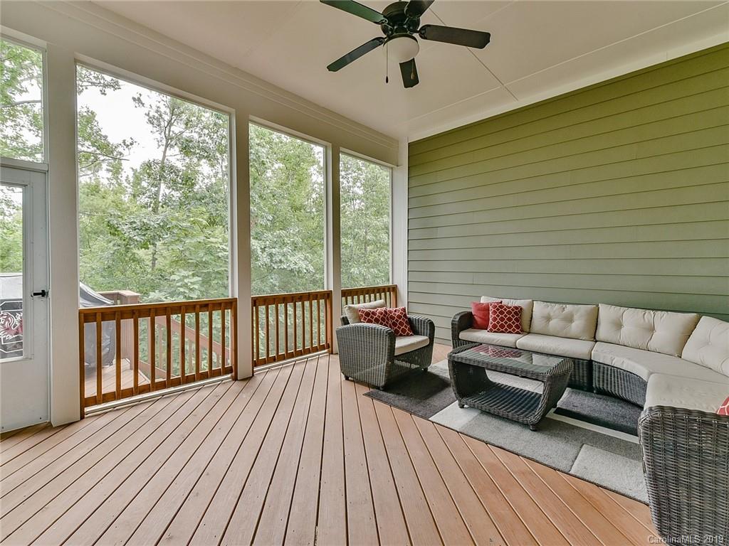 313 Olmstead Street Fort Mill, SC 29708 - Photo 36 of 48 a balcony with wooden floor and furniture