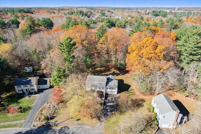 a view of a yard with wooden fence