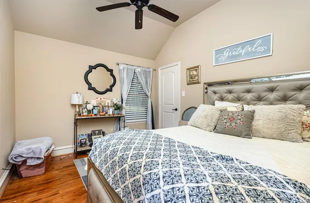 a bedroom with a bed and a chair