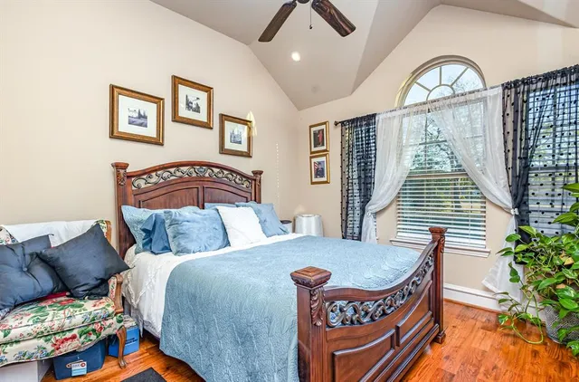 a bedroom with furniture and a window