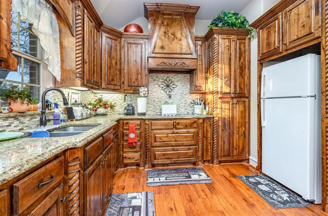 a view of a kitchen with a sink and cabinets