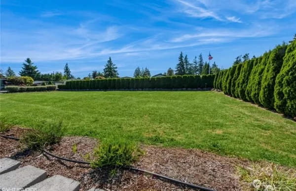 a view of outdoor space with seating and green space