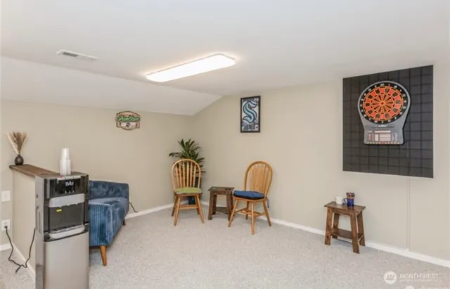 a workspace with furniture and white walls