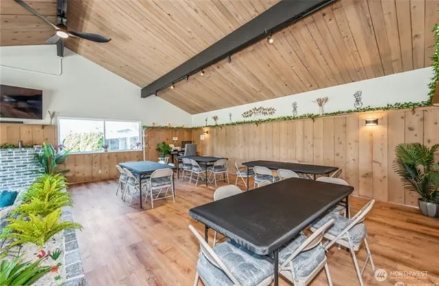 a outdoor space with a table and chairs