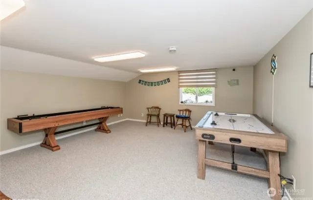 a outdoor space with a table and chairs