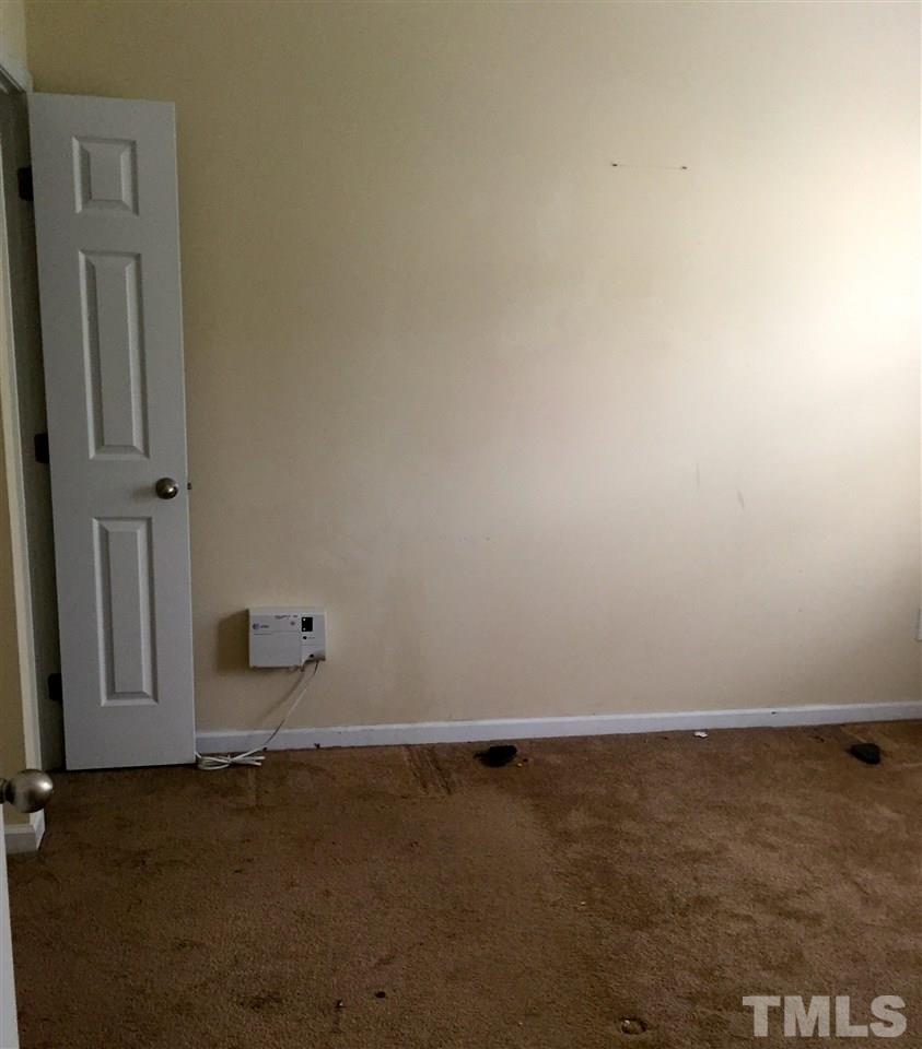 3720 Bison Hill Lane Raleigh, NC 27604 - Photo 8 of 9 an empty room with a door