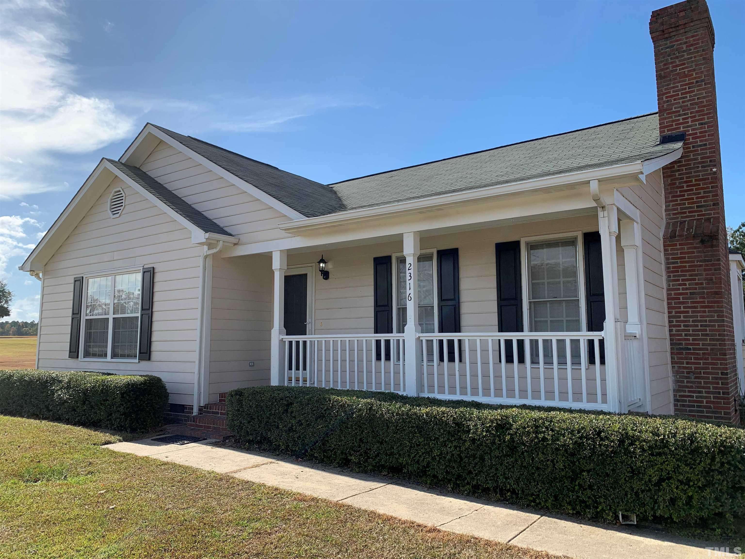 2316 Rolesville Road Wake Forest, NC 27587 - Photo 1 of 17 a view of a house with a yard