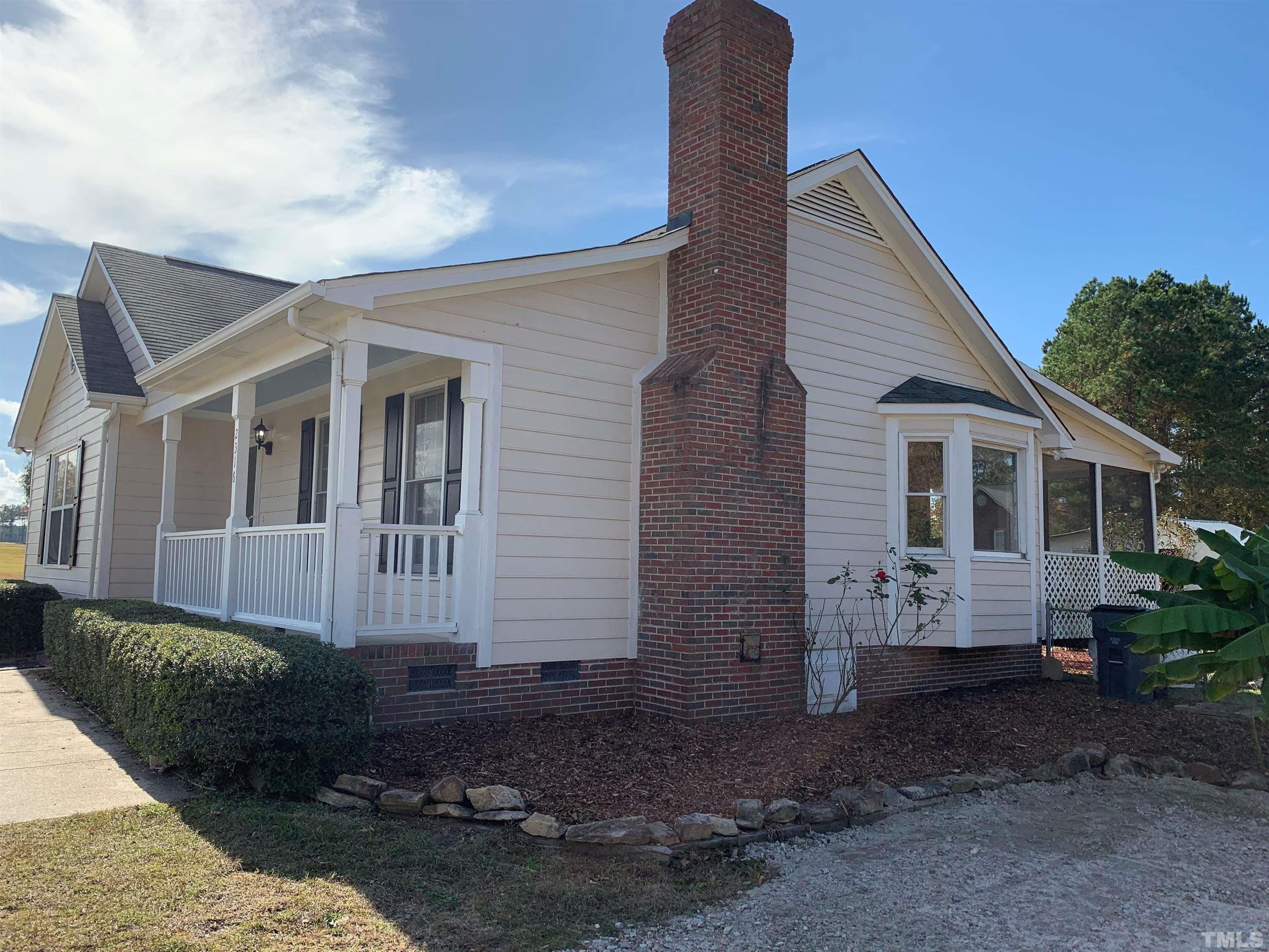 2316 Rolesville Road Wake Forest, NC 27587 - Photo 2 of 17 a view of a house with a yard