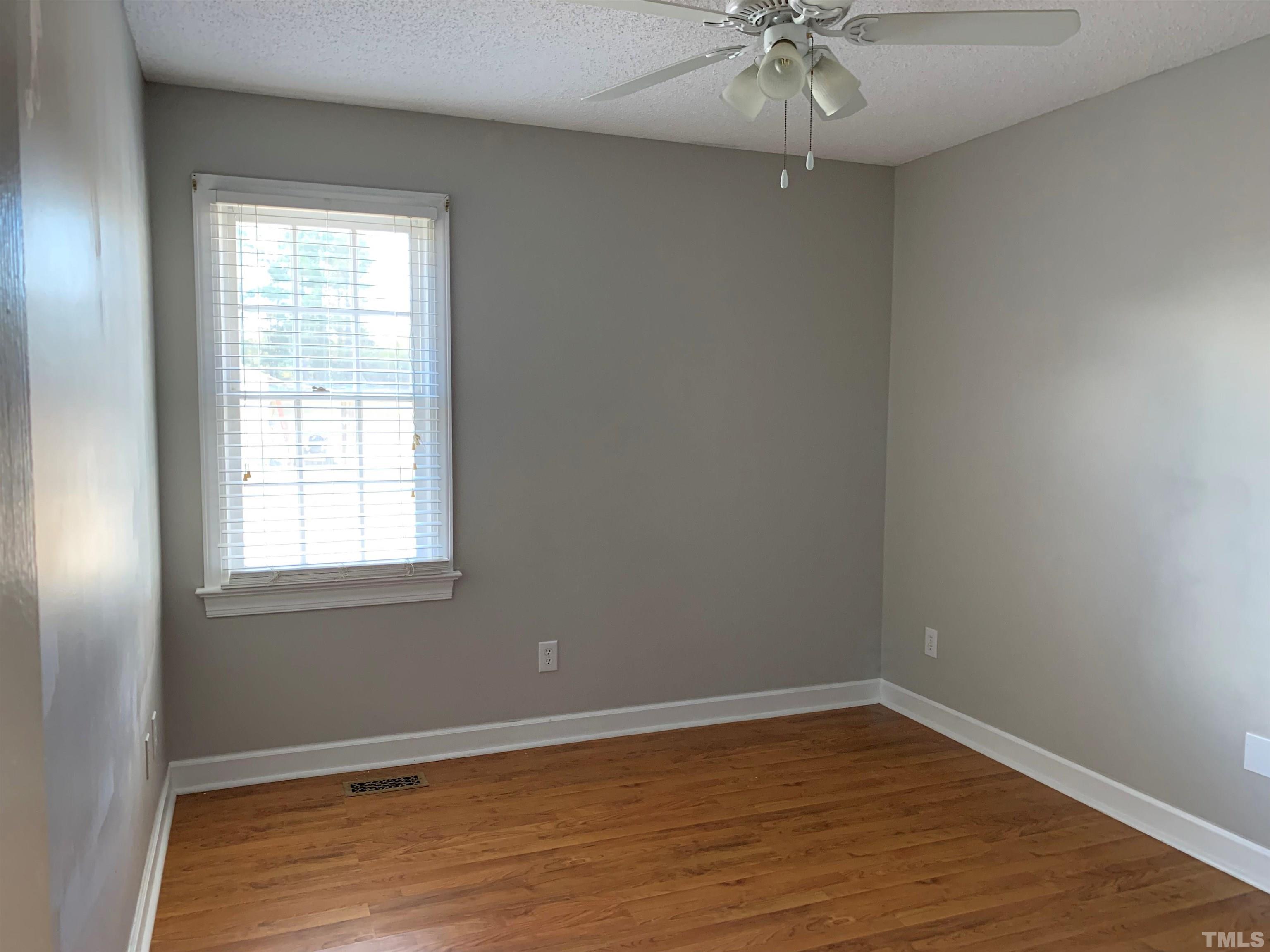 2316 Rolesville Road Wake Forest, NC 27587 - Photo 7 of 17 wooden floor in an empty room with a window
