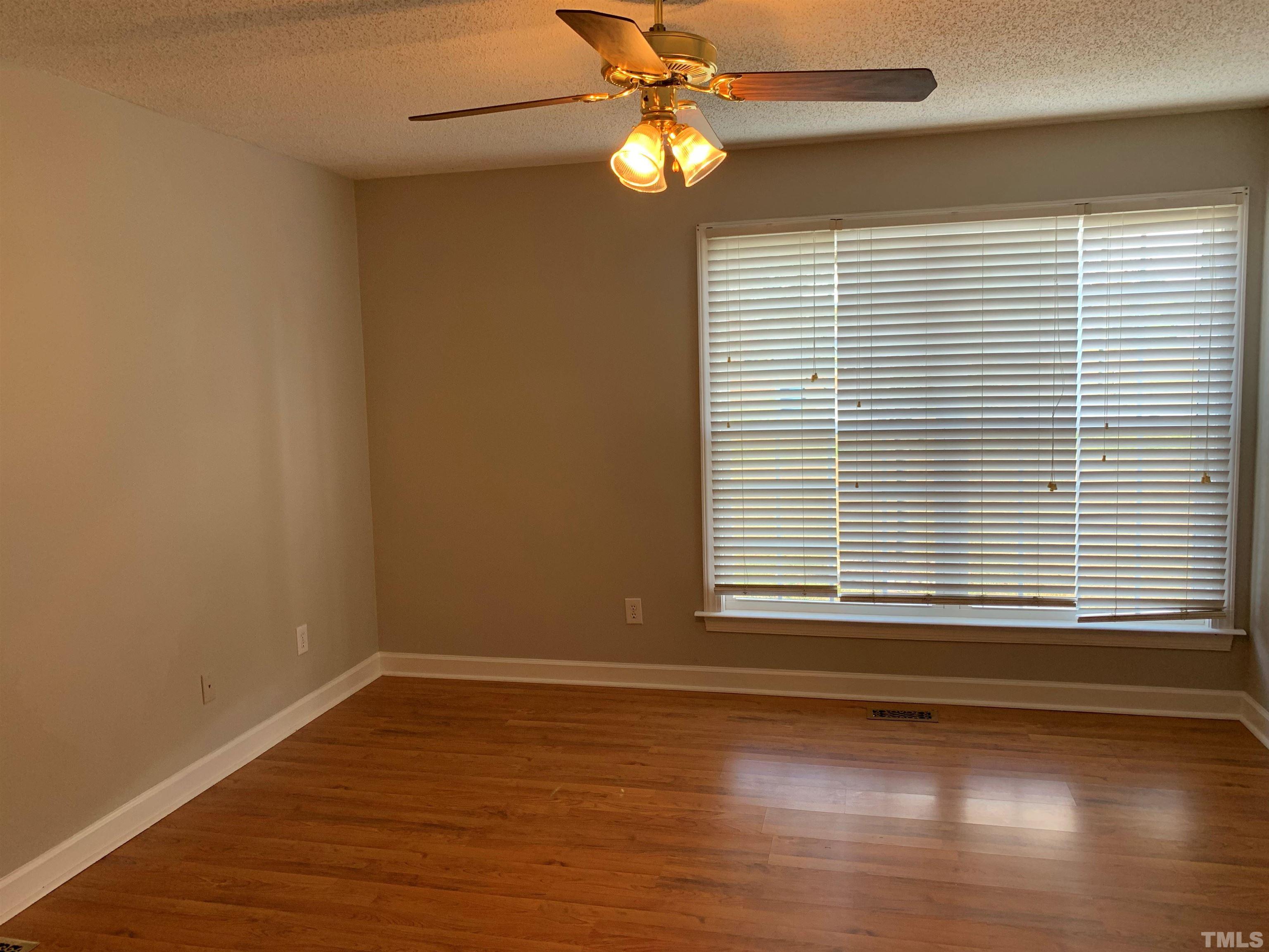 2316 Rolesville Road Wake Forest, NC 27587 - Photo 10 of 17 a view of a livingroom with wooden floor and a window