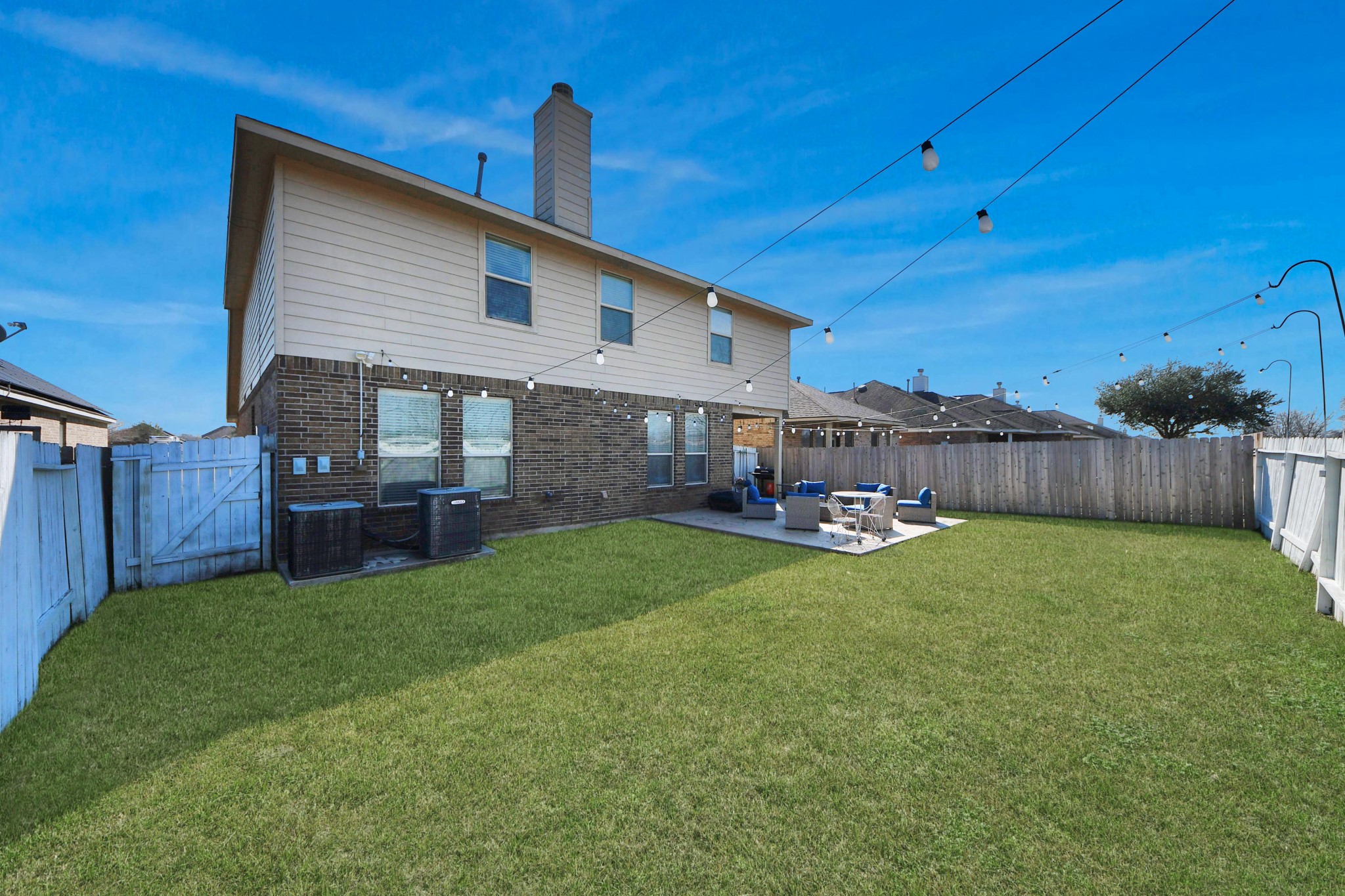 12119 Redbud Brook Trail Houston, TX 77089 - Photo 11 of 48 a view of a backyard with table and chairs and wooden fence