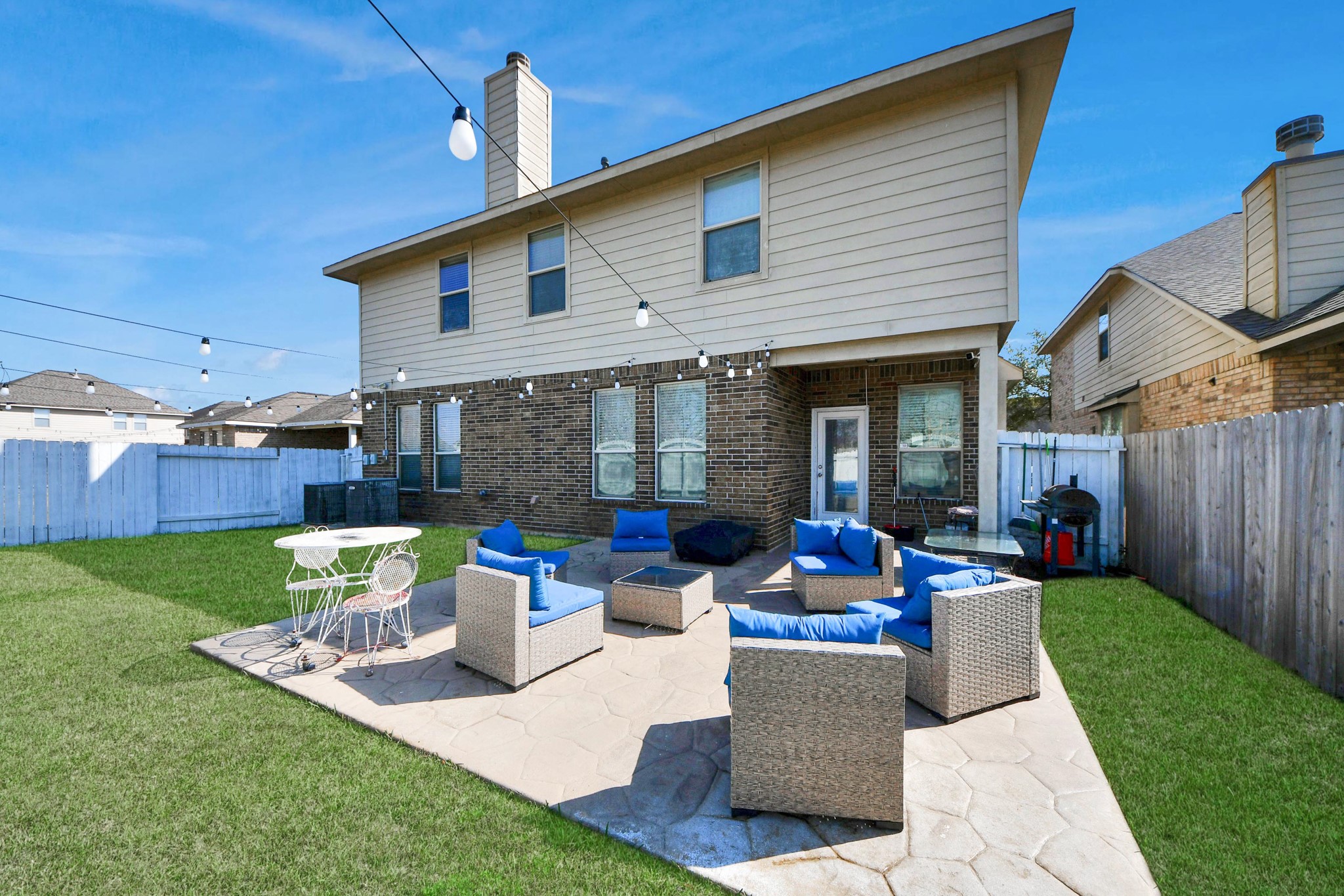 12119 Redbud Brook Trail Houston, TX 77089 - Photo 12 of 48 a front view of a house with sitting area and garden