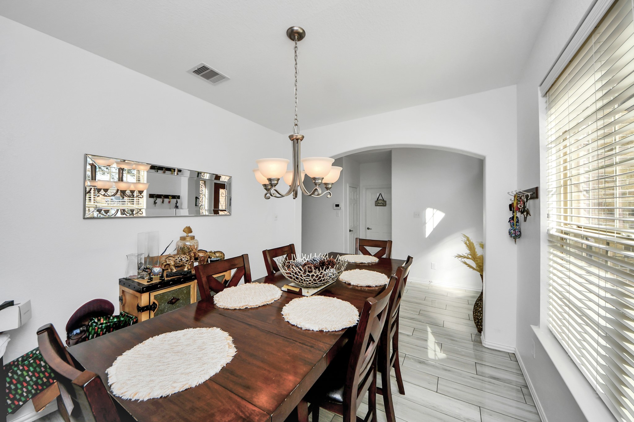 12119 Redbud Brook Trail Houston, TX 77089 - Photo 16 of 48 a view of a dining room with furniture and wooden floor