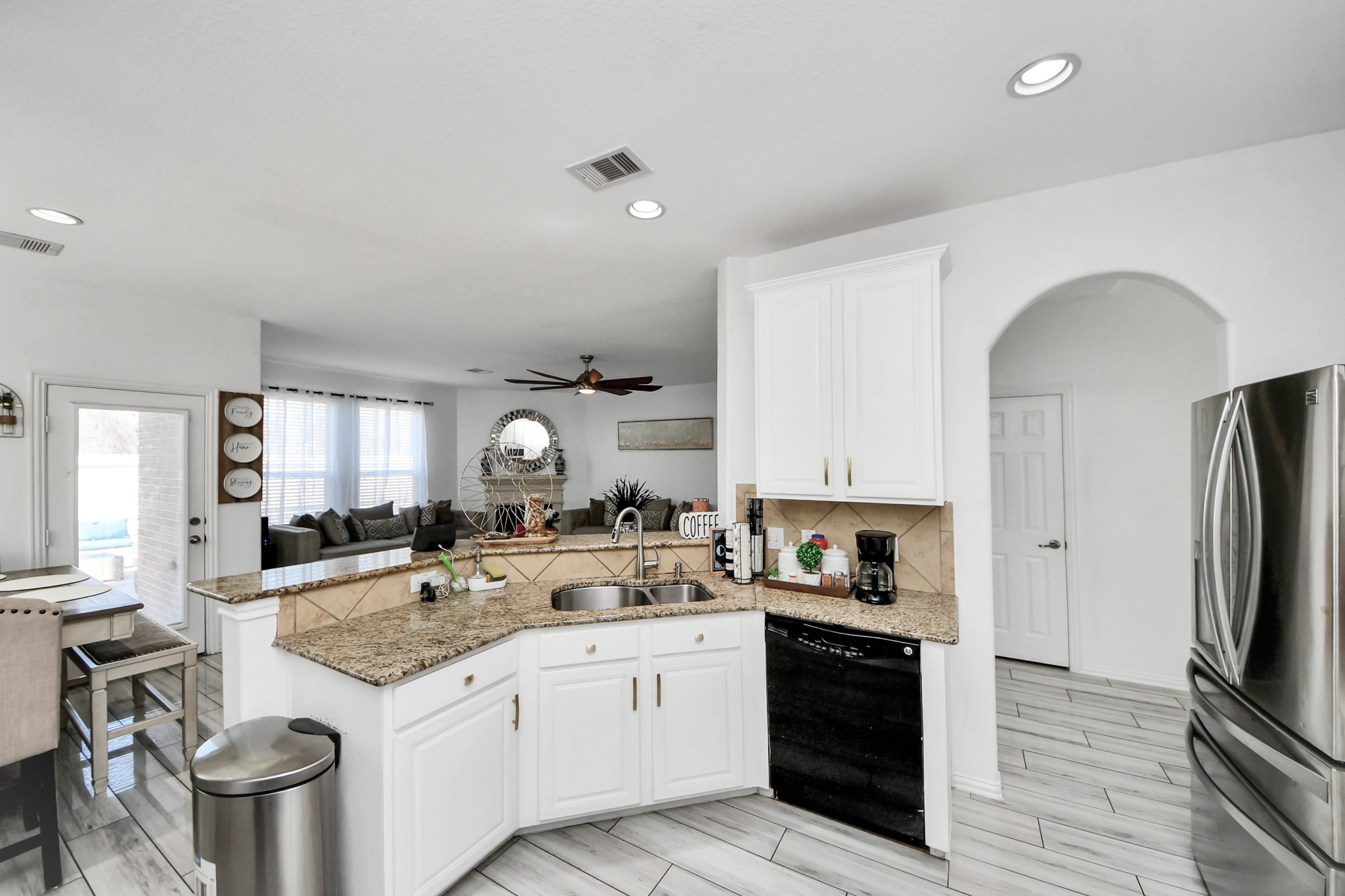 12119 Redbud Brook Trail Houston, TX 77089 - Photo 21 of 48 a kitchen with a sink stove and refrigerator