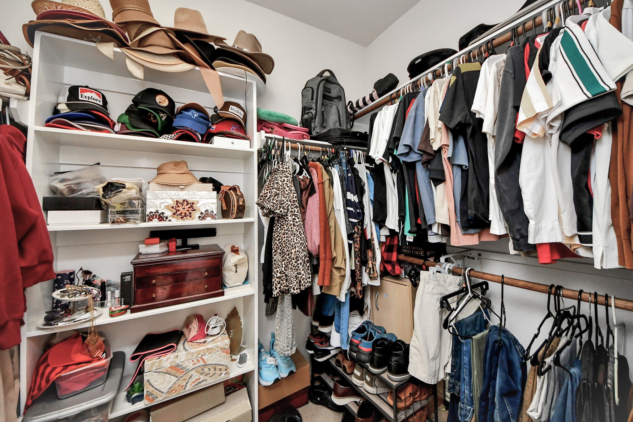 12119 Redbud Brook Trail Houston, TX 77089 - Photo 36 of 48 a view of walk in closet with clothes and shoes