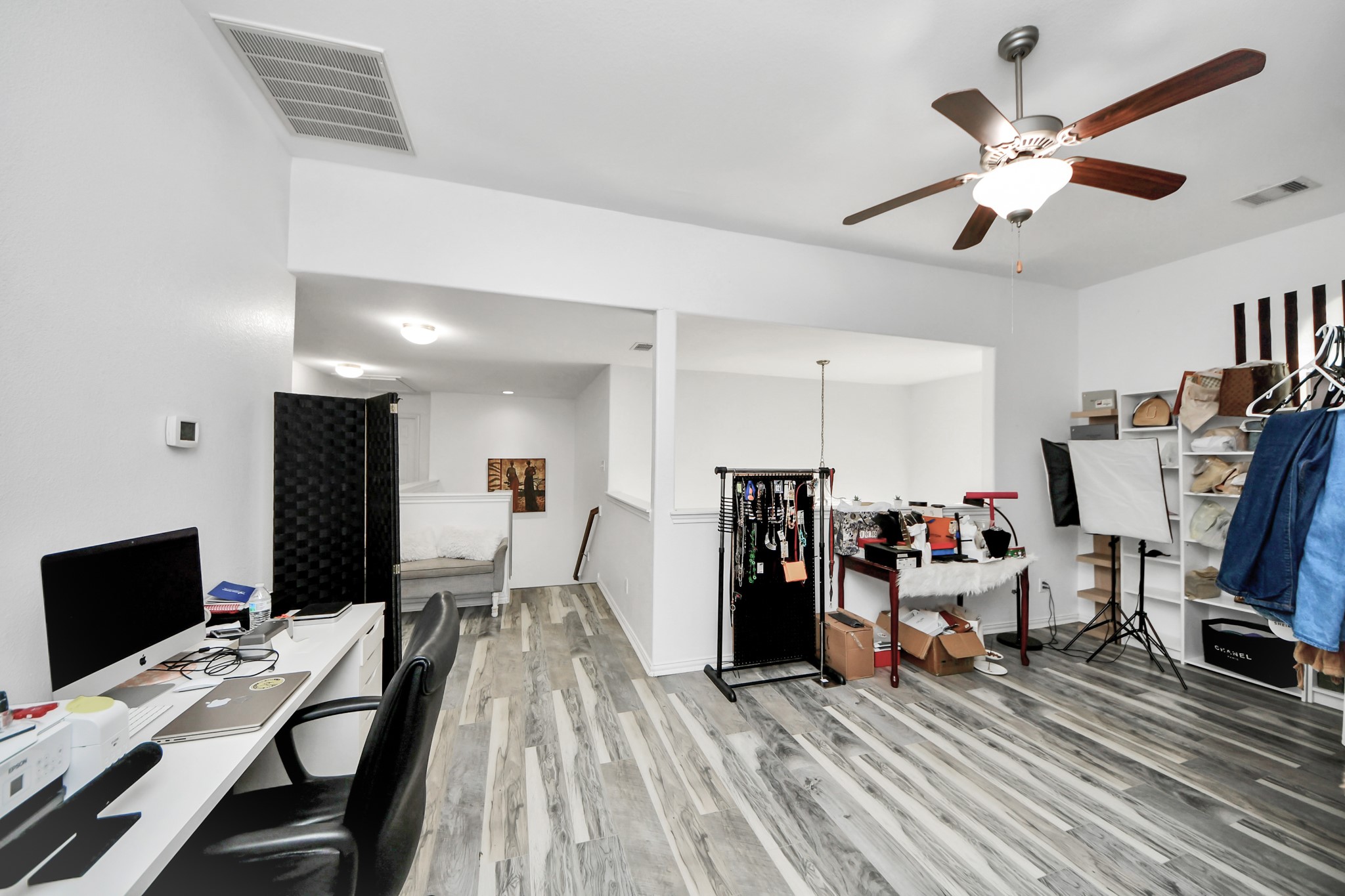 12119 Redbud Brook Trail Houston, TX 77089 - Photo 38 of 48 a view of a workspace with furniture and a ceiling fan