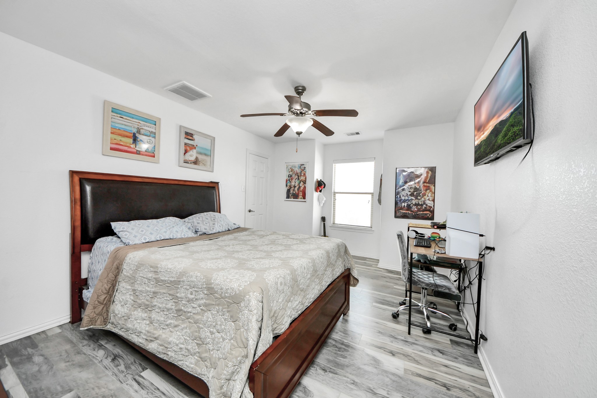 12119 Redbud Brook Trail Houston, TX 77089 - Photo 41 of 48 a bedroom with a bed and a flat screen tv