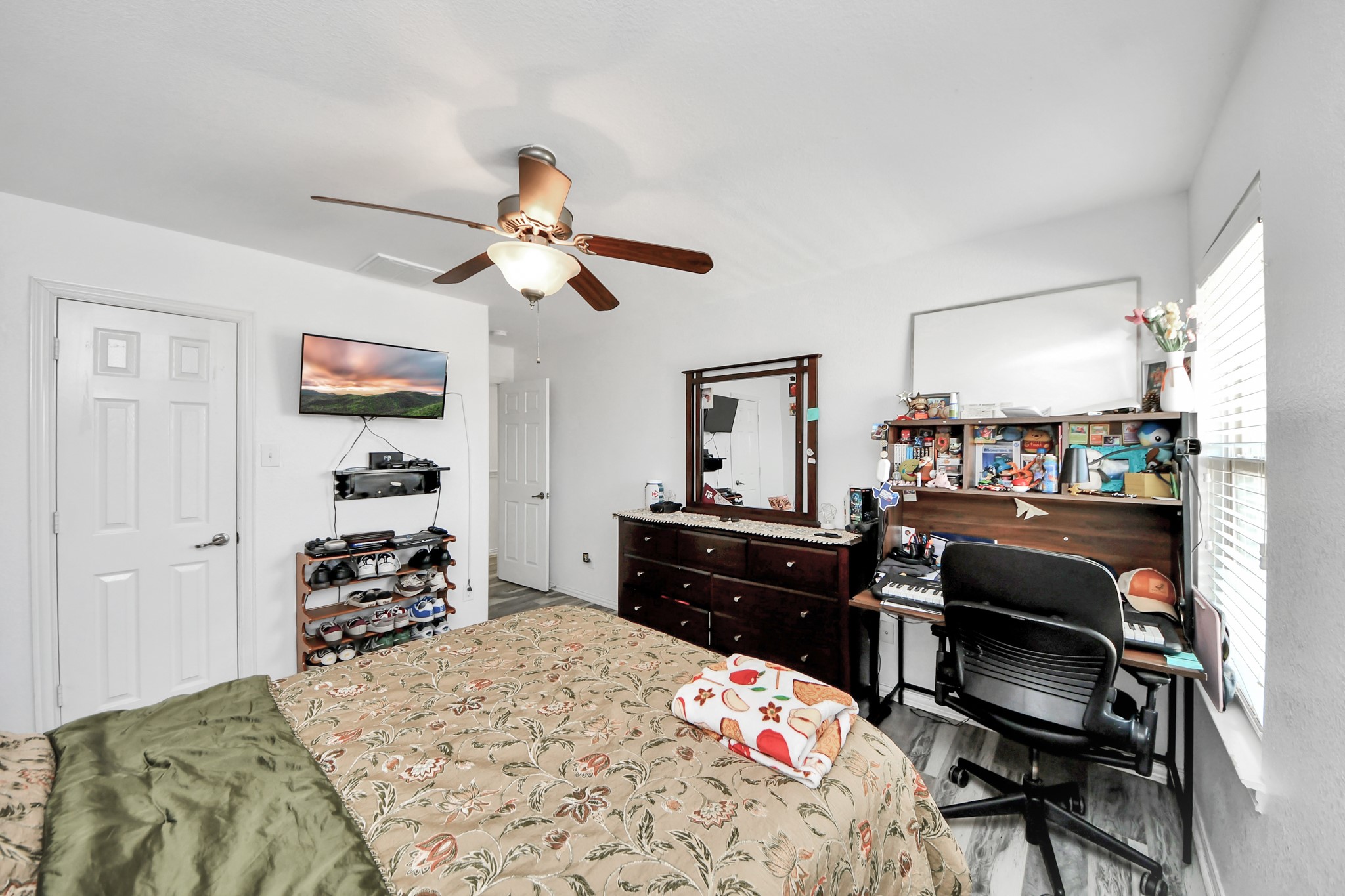 12119 Redbud Brook Trail Houston, TX 77089 - Photo 45 of 48 a bedroom with a bed and a dresser in it