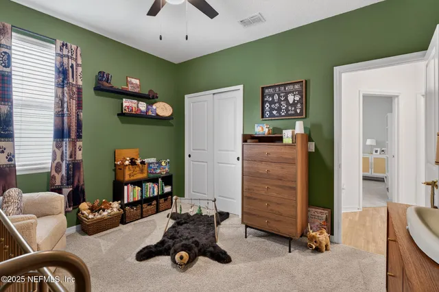 a view of a livingroom with furniture and a flat screen tv