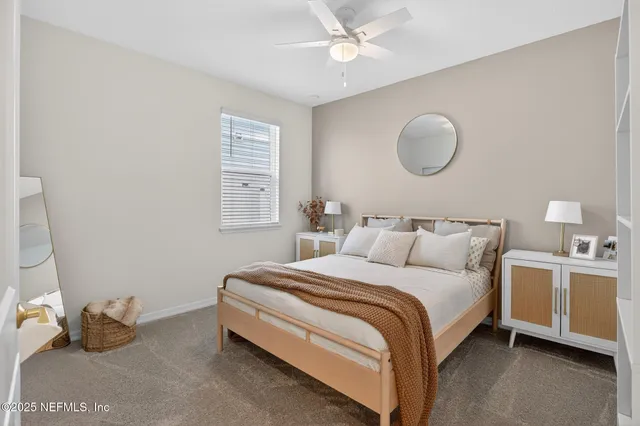 a bedroom with bed and window