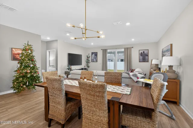 a living room with fireplace furniture and a flat screen tv