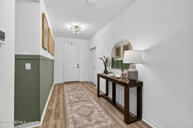 a view of a hallway with front door
