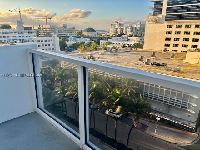 100 Lincoln Road, Unit 823 Miami Beach, FL 33139 - Photo 13 of 15 a view of a balcony with wooden floor