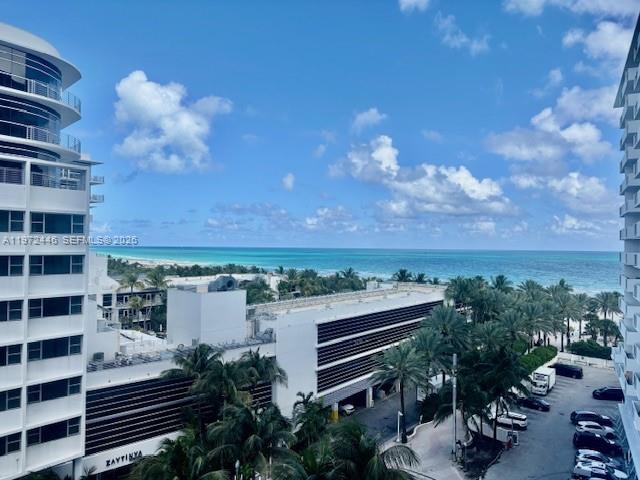 100 Lincoln Road, Unit 823 Miami Beach, FL 33139 - Photo 15 of 15 a view of a balcony with two chairs and a potted plant
