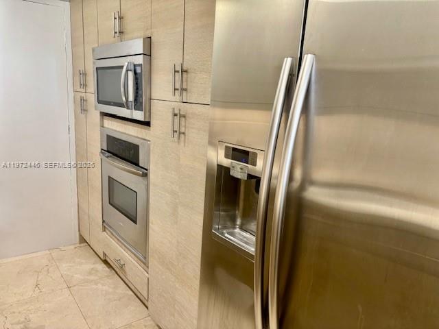 100 Lincoln Road, Unit 823 Miami Beach, FL 33139 - Photo 3 of 15 a view of a refrigerator and an empty room