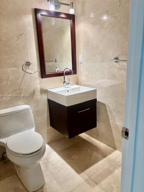 100 Lincoln Road, Unit 823 Miami Beach, FL 33139 - Photo 8 of 15 a bathroom with a toilet sink and mirror