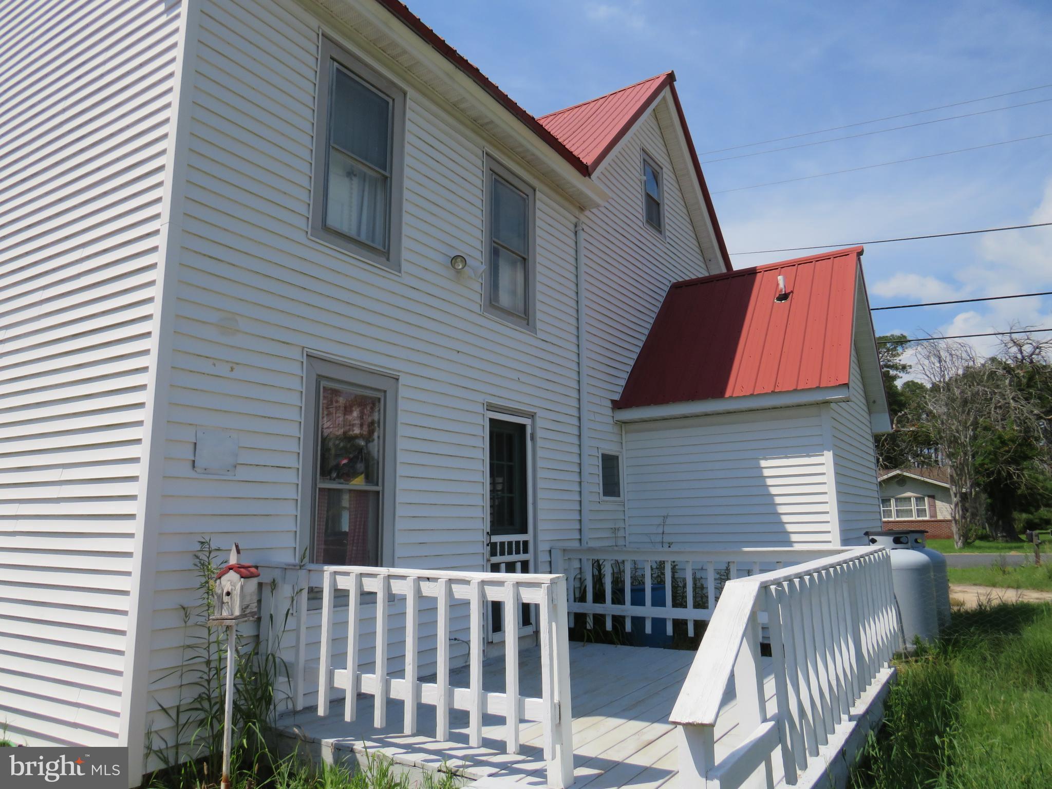 3289 Sackertown Road Crisfield, MD 21817 - Photo 2 of 25 a view of backyard with deck and outdoor seating