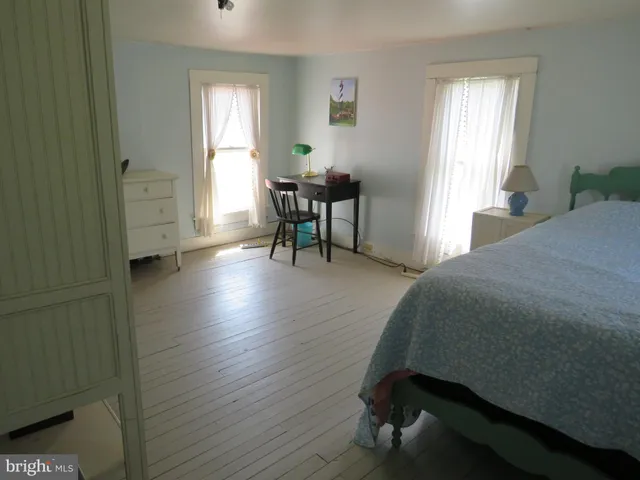 a bed room with a bed and a window