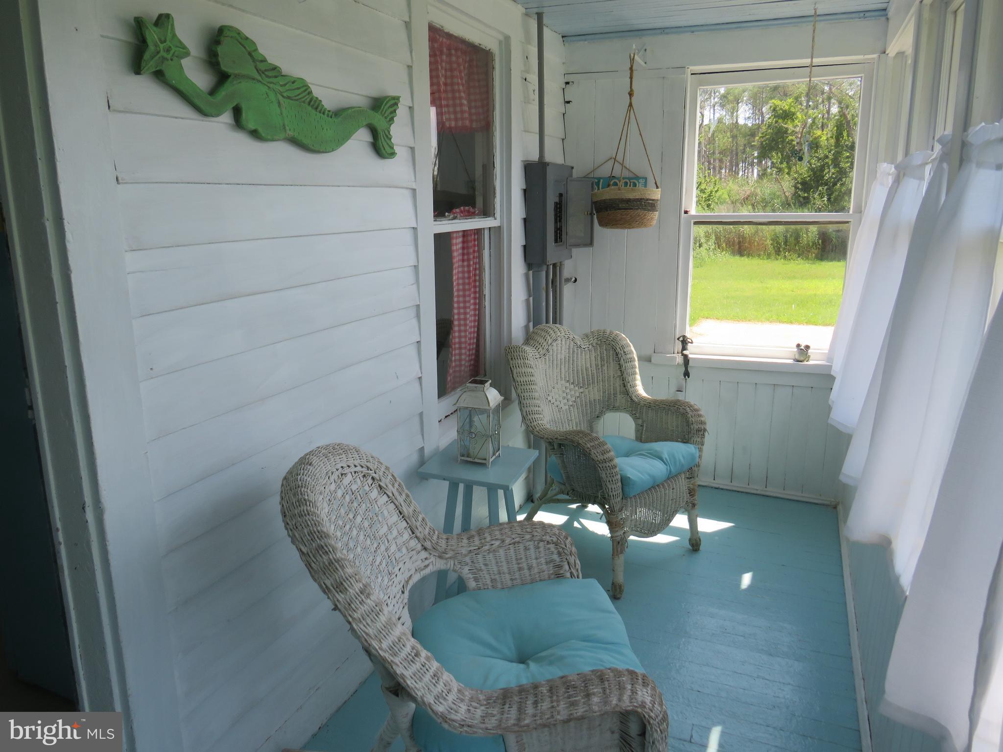 3289 Sackertown Road Crisfield, MD 21817 - Photo 24 of 25 a living room with furniture and a large window