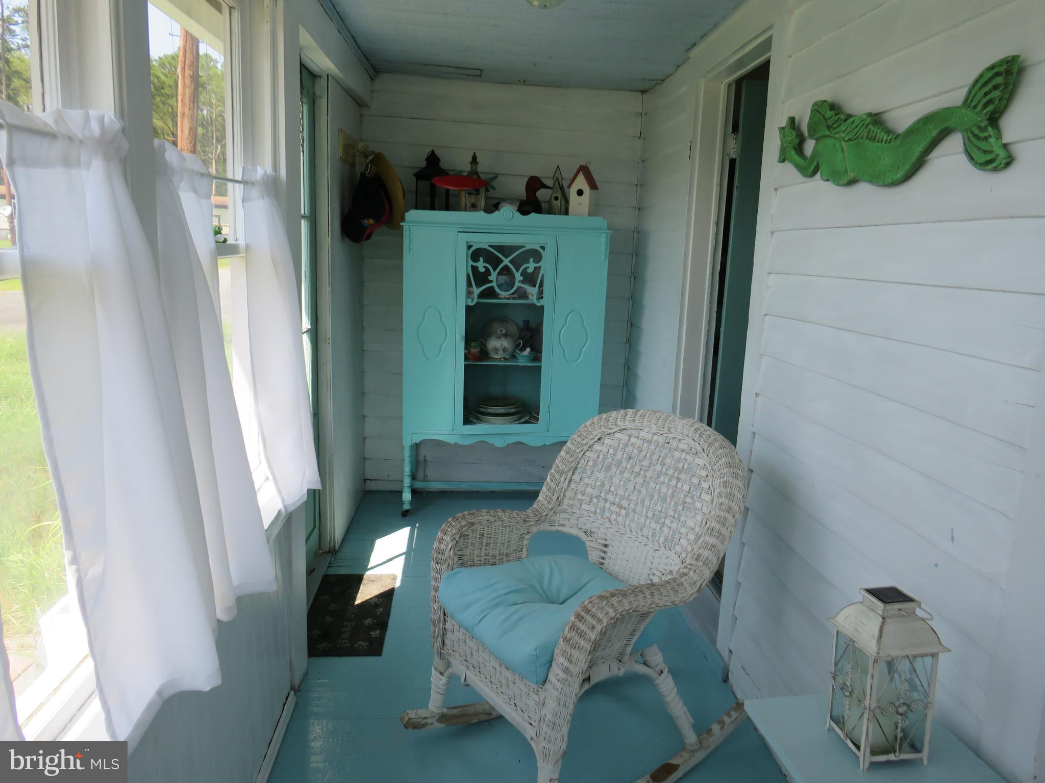 3289 Sackertown Road Crisfield, MD 21817 - Photo 25 of 25 a living room with furniture and a window