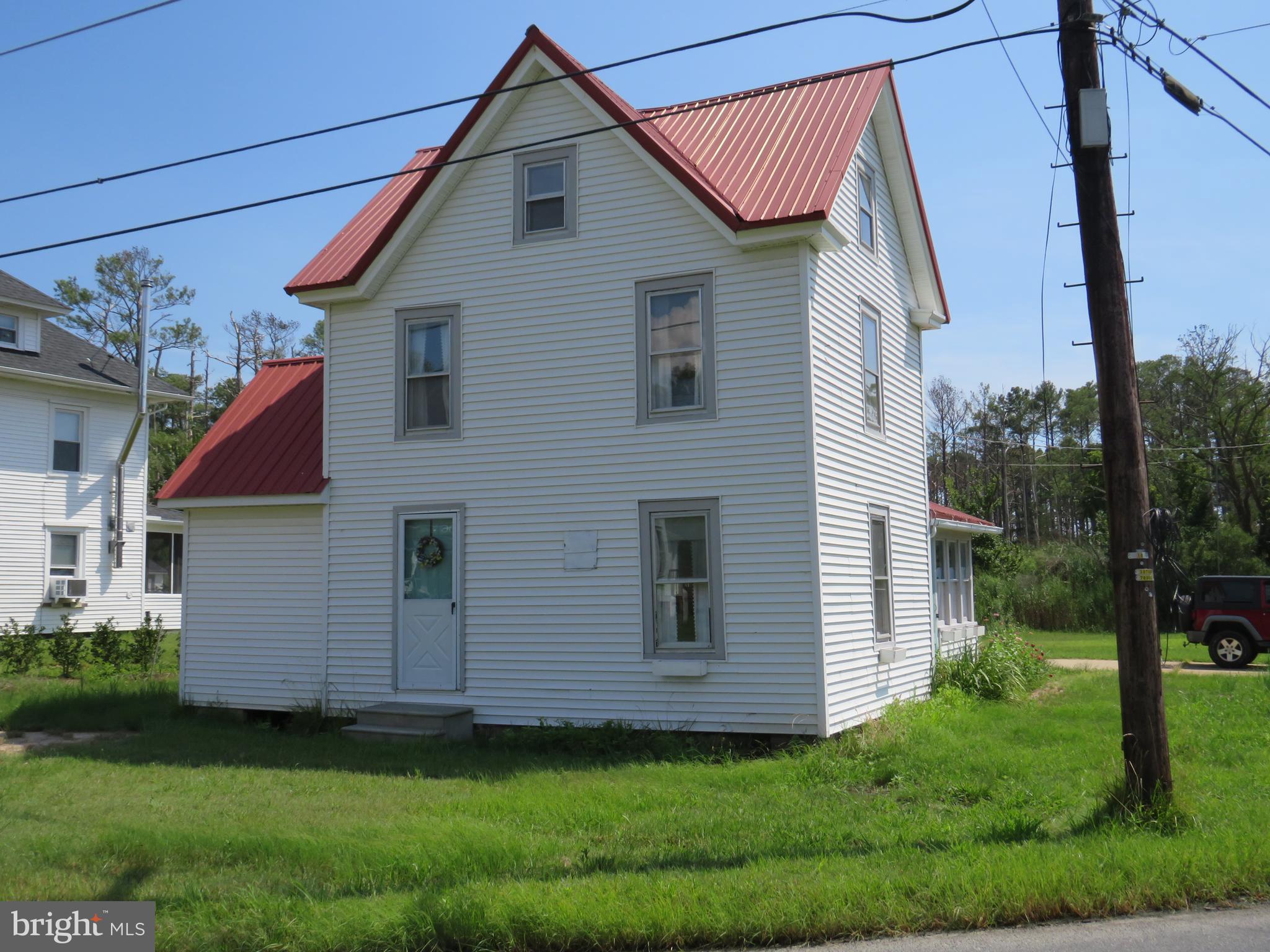 3289 Sackertown Road Crisfield, MD 21817 - Photo 5 of 25 a view of a house with a yard