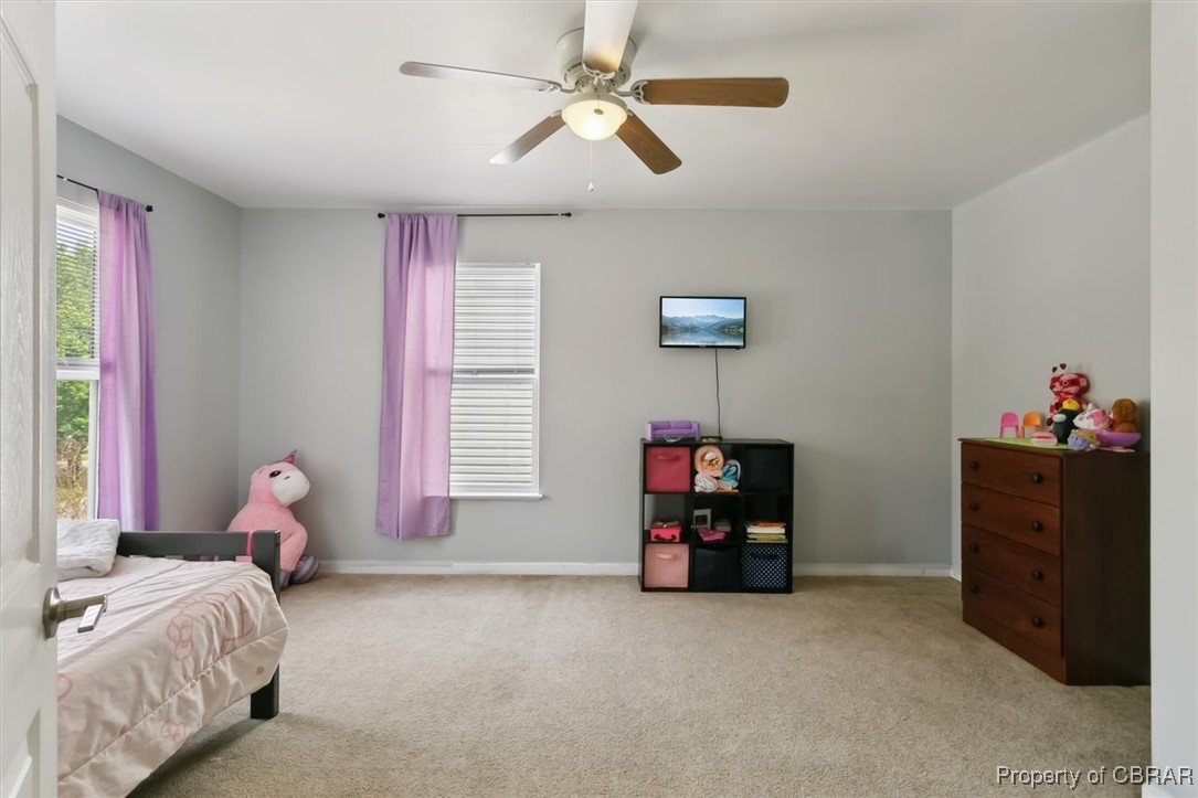 127 Low Ridge Road Williamsburg, VA 23185 - Photo 24 of 35 Bedroom featuring light carpet, baseboards, and a ceiling fan