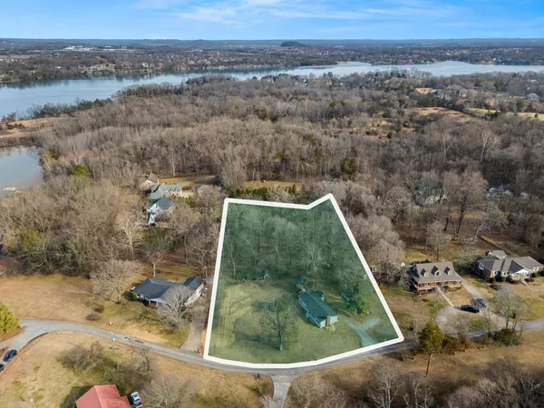 an aerial view of a residential houses with outdoor space
