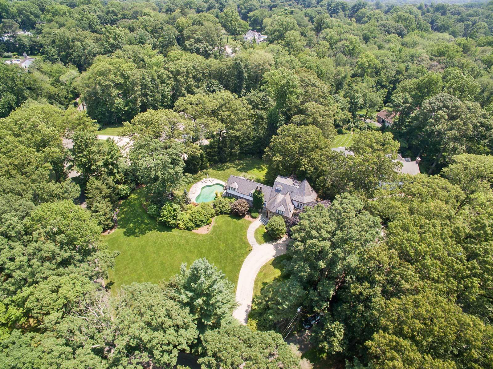 6 Woodley Road Darien, CT 06820 - Photo 1 of 37 a aerial view of a house with a yard and lake view