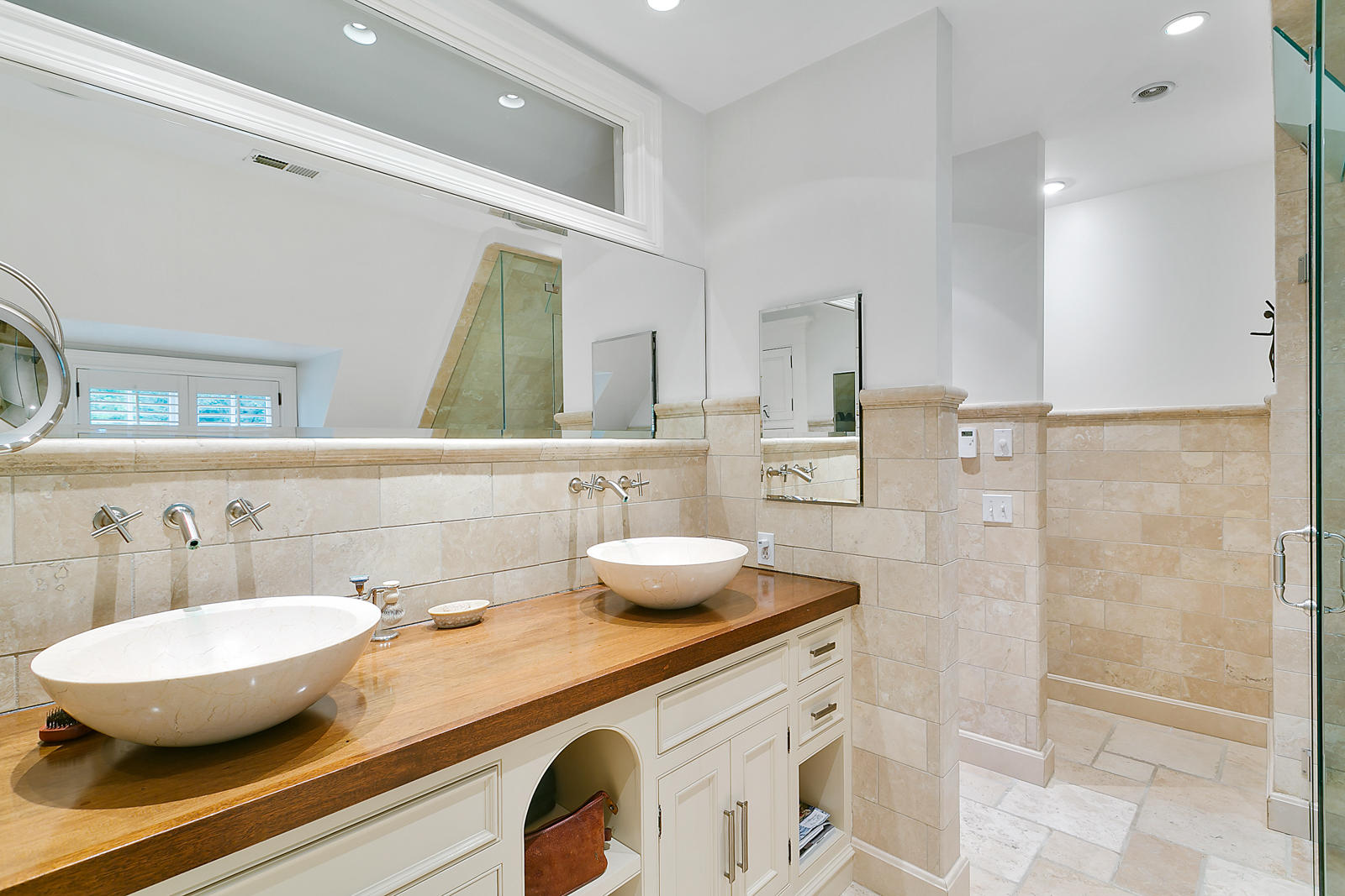 6 Woodley Road Darien, CT 06820 - Photo 22 of 37 a bathroom with a double vanity sink and a mirror