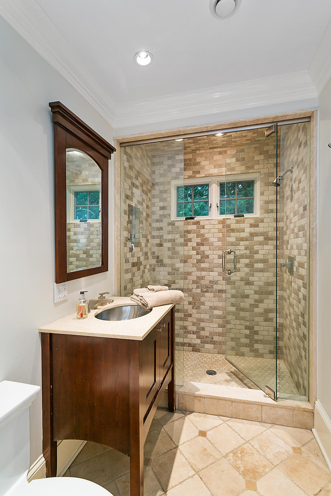 6 Woodley Road Darien, CT 06820 - Photo 26 of 37 a bathroom with a sink and a mirror