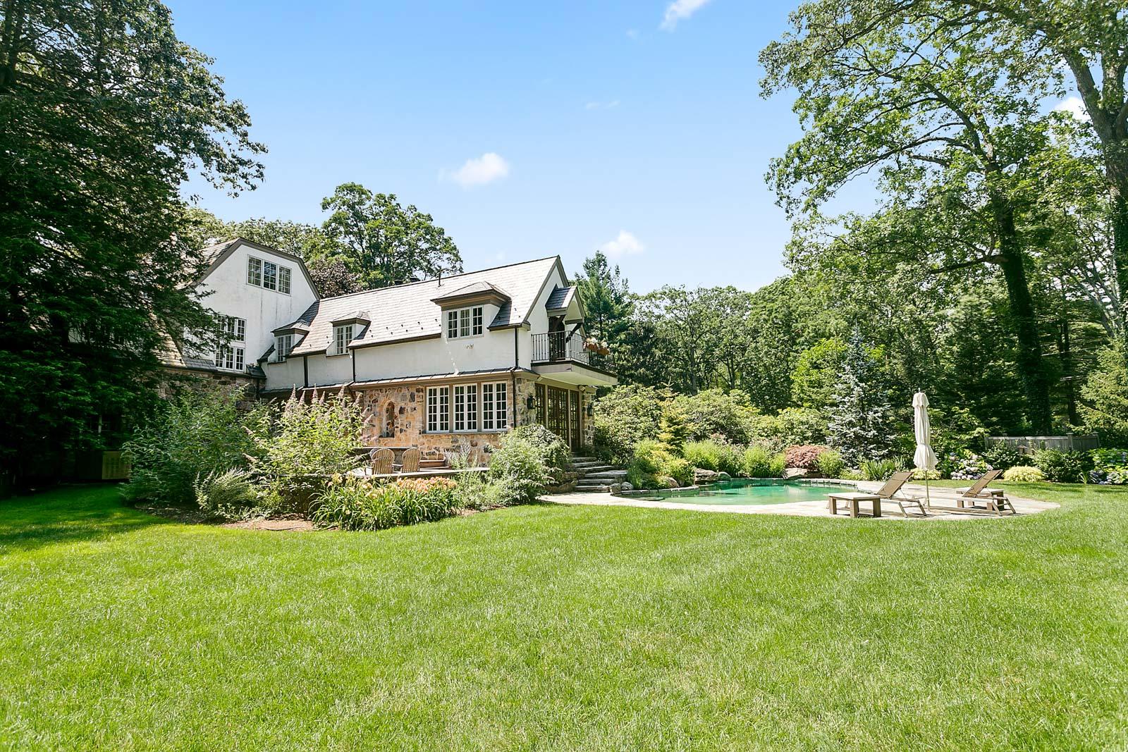 6 Woodley Road Darien, CT 06820 - Photo 5 of 37 a view of a house with a yard and sitting area