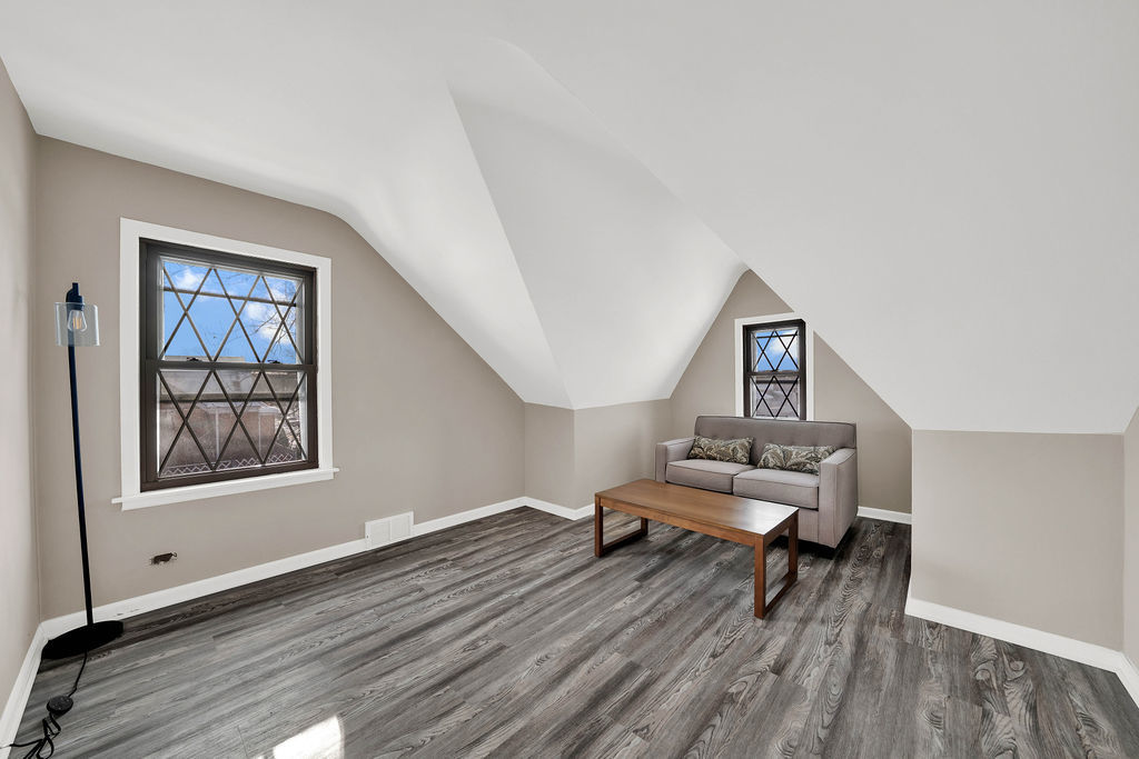 6559 South Kilpatrick Avenue Chicago, IL 60629 - Photo 19 of 26 a living room with furniture and a wooden floor