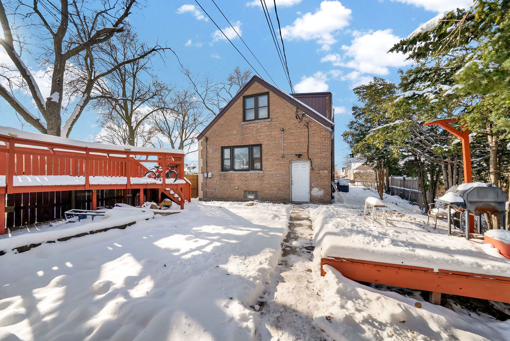6559 South Kilpatrick Avenue Chicago, IL 60629 - Photo 25 of 26 a view of a house with snow in the patio