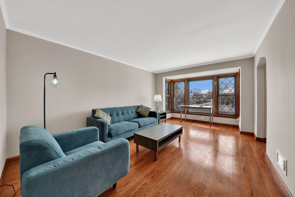 6559 South Kilpatrick Avenue Chicago, IL 60629 - Photo 4 of 26 a living room with furniture and a window