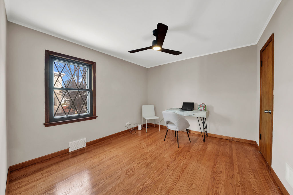 6559 South Kilpatrick Avenue Chicago, IL 60629 - Photo 10 of 26 a work room with furniture and wooden floor
