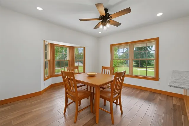 a dining room with furniture window wooden floor