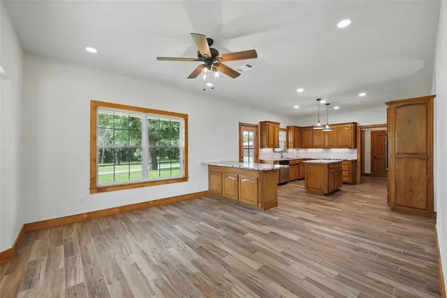 a view of kitchen with wooden floor and window