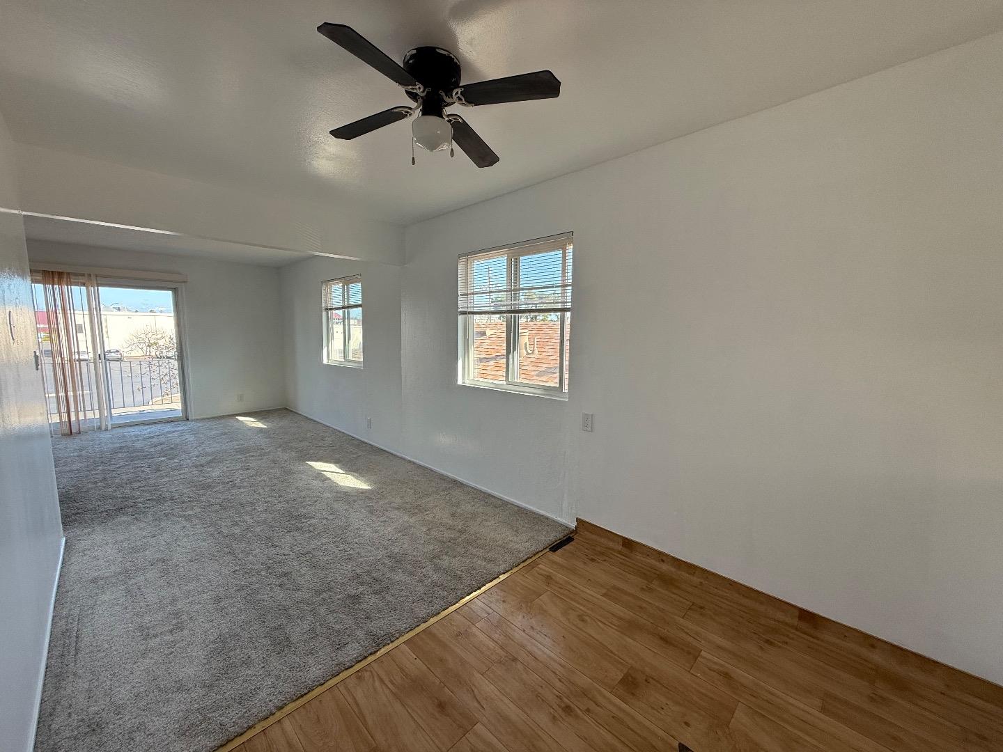 117 Adler Avenue Campbell, CA 95008 - Photo 4 of 7 an empty room with wooden floor and windows